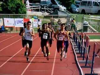 Boys compete in a track meet