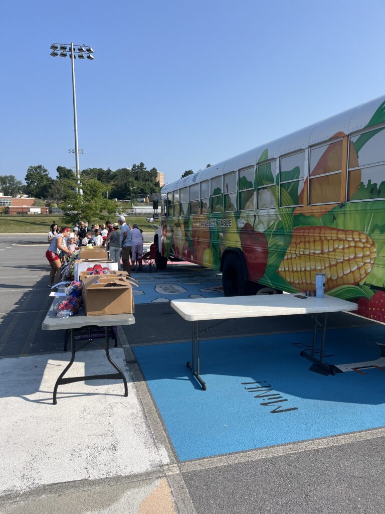 volunteers hand out fresh vegetables