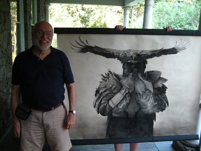 Illustrator Joseph A Smith stands in front of his work